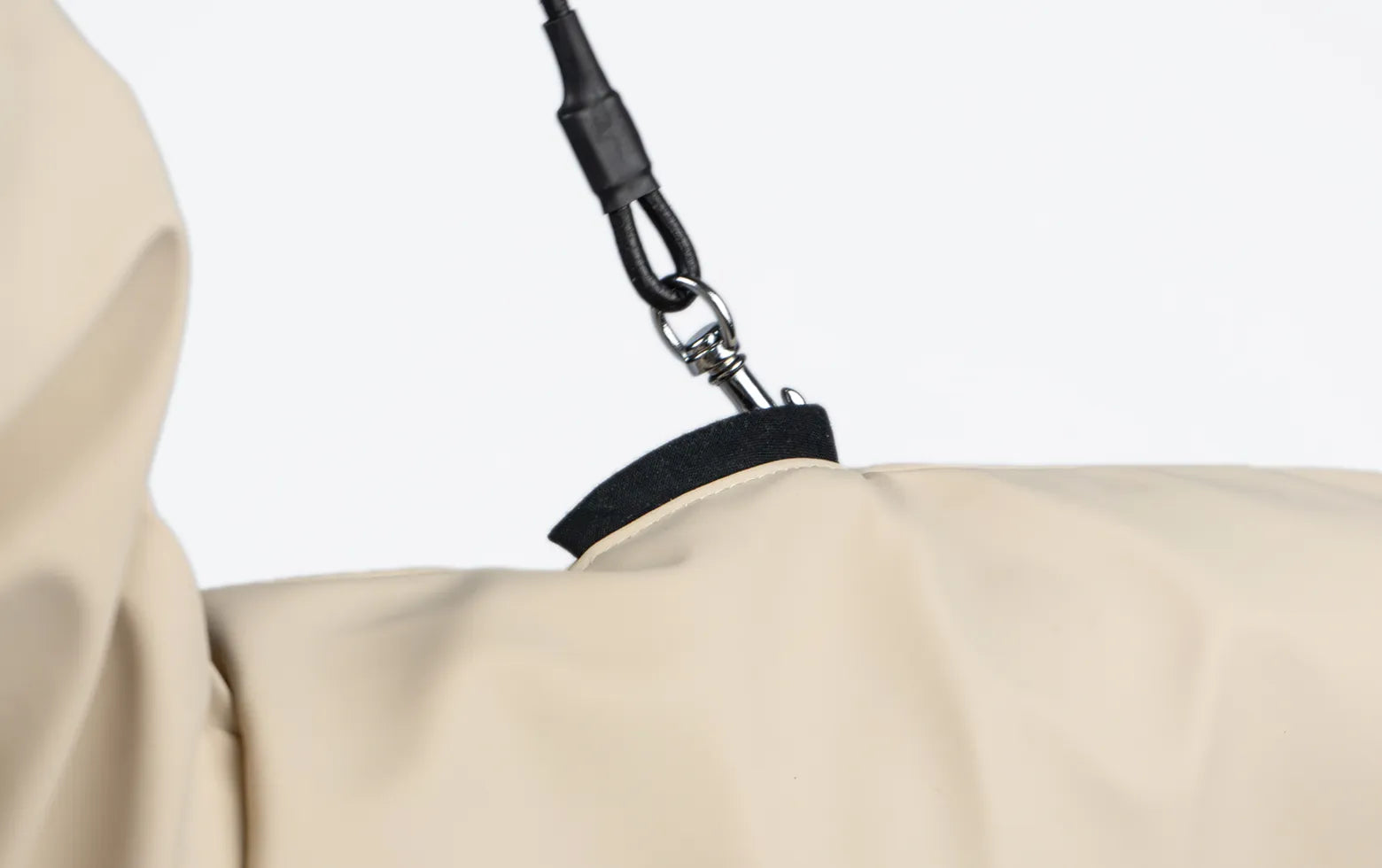 A closeup photo of a harness opening on a Italian Greyhound and Whippet raincoat by Strela Studio